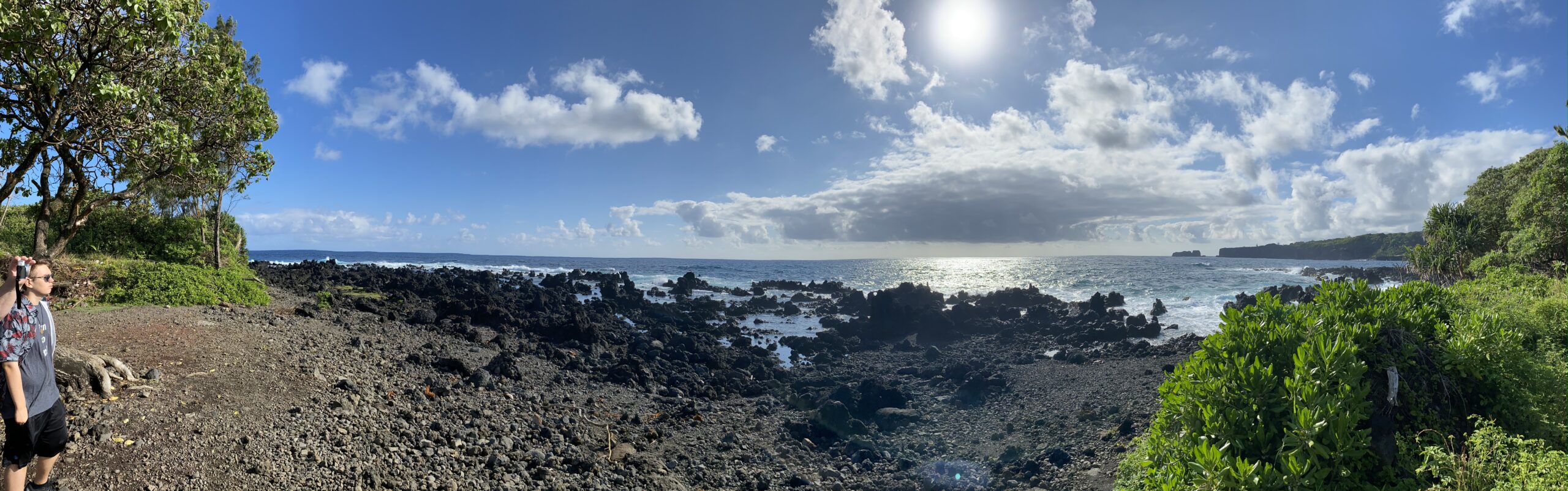Justin Johnston from Best Helicopter Tours in Maui at a Black sand beach at the end of road to hana