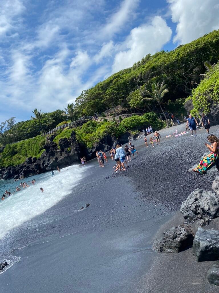 Justin Johnston from Best Helicopter Tours in Maui at a Black sand beach at the end of road to hana 8