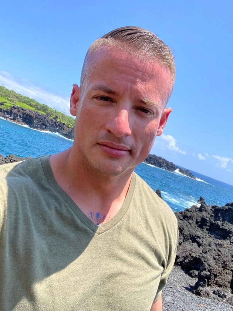 Justin Johnston from Best Helicopter Tours in Maui at a Black sand beach at the end of road to hana 18