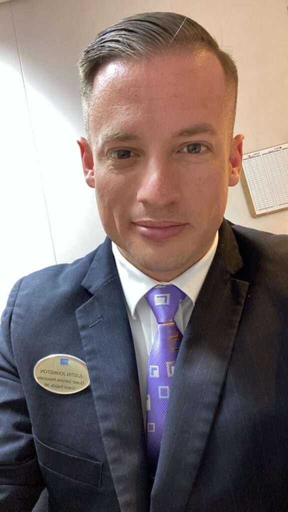 Justin Johnston working as Guest services before being promoted to Shore Excursions