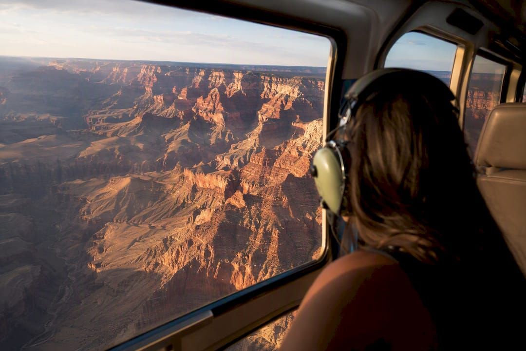 View of helicopter flying over Grand Canyon rock formations
