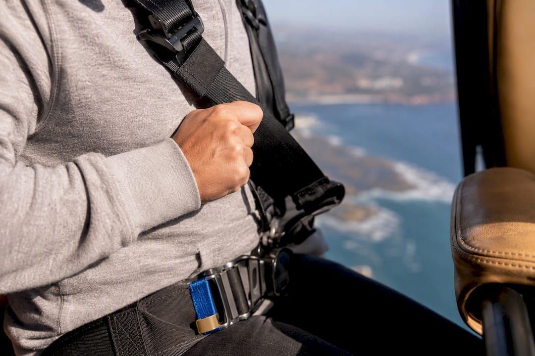 Passenger checking harness at cabin threshold