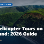 Aerial view of green cliffs meeting the ocean, a highlight of the best helicopter tours on the Big Island